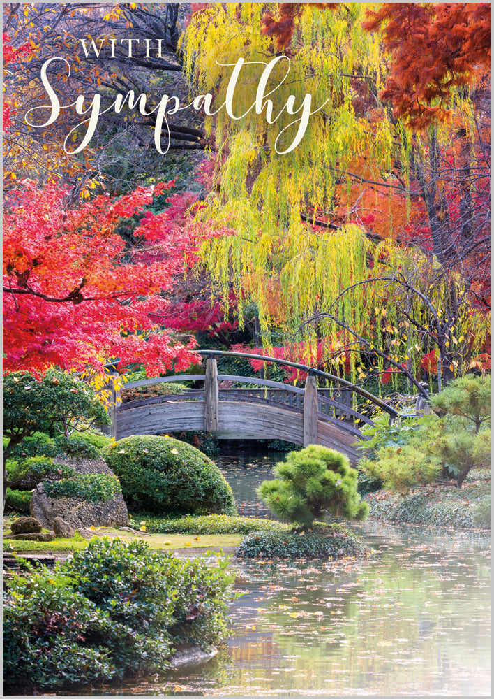 Sympathy - A wooden moon bridge over a stream